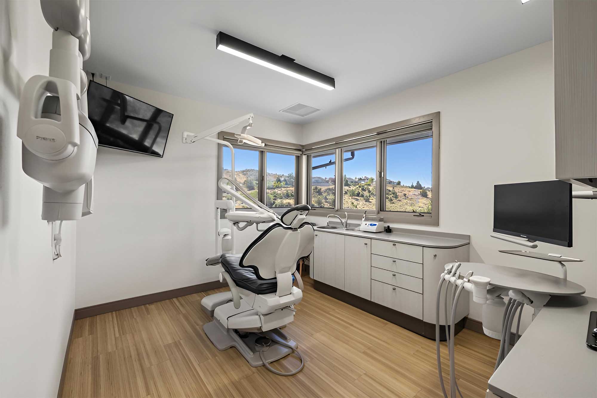 A treatment room at Smith Brothers Dental, with a window looking out over Klamath Falls