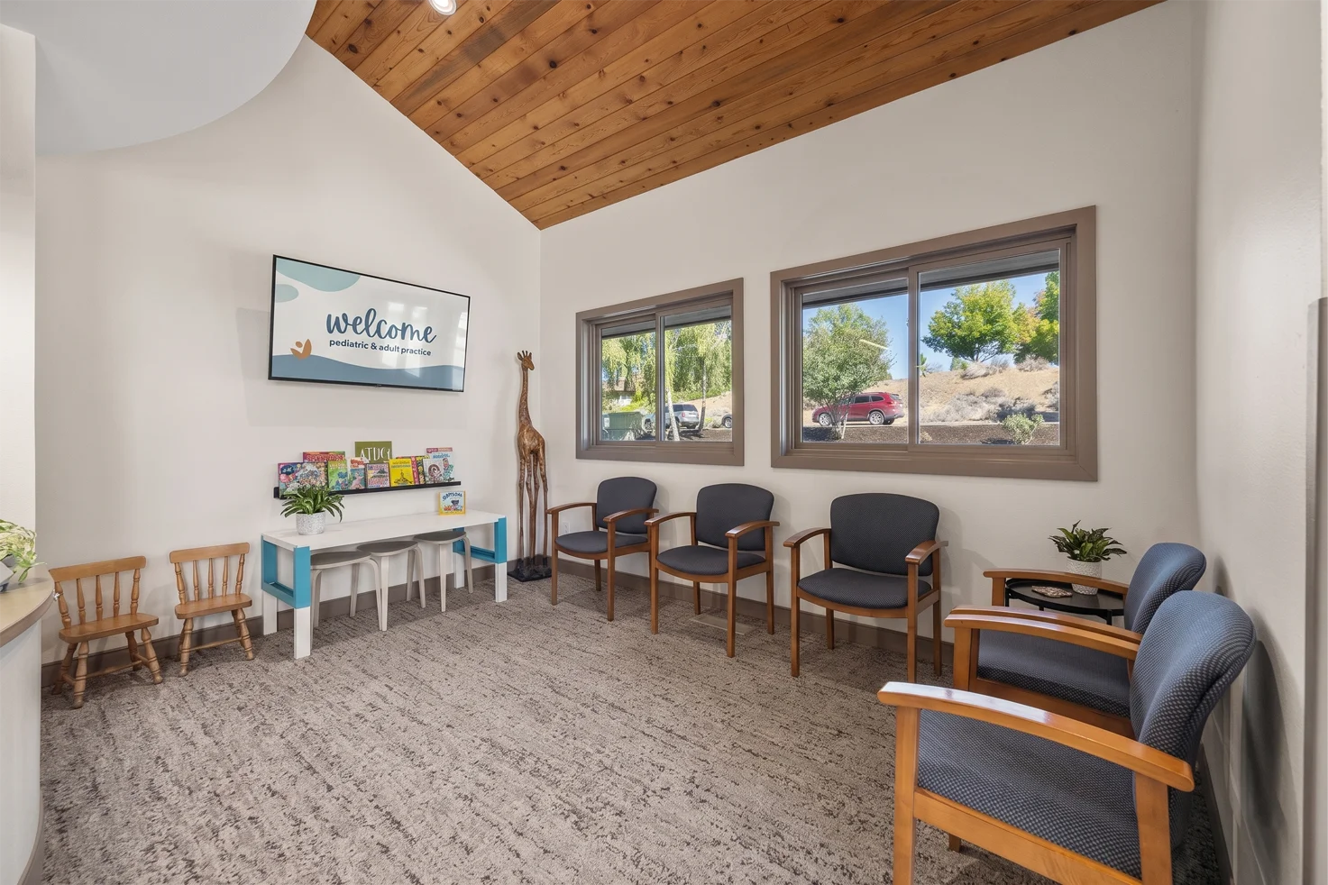 The waiting area at Smith Brothers Dental, with a children's table, books and small chairs